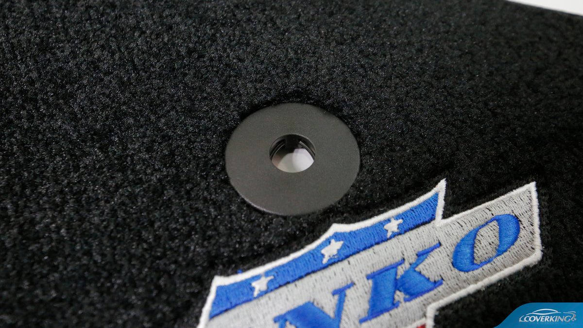 Do the Coverking Custom Floor Mats have stain protection?