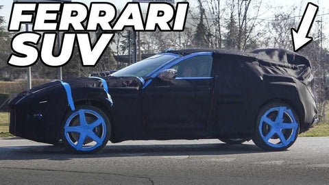 Ferrari Purosangue SUV Spied Covered in Blue Tape and Camo