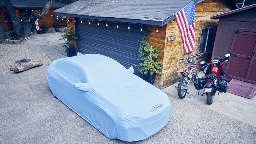 Light blue Coverking car cover with mirror pockets and full US flag