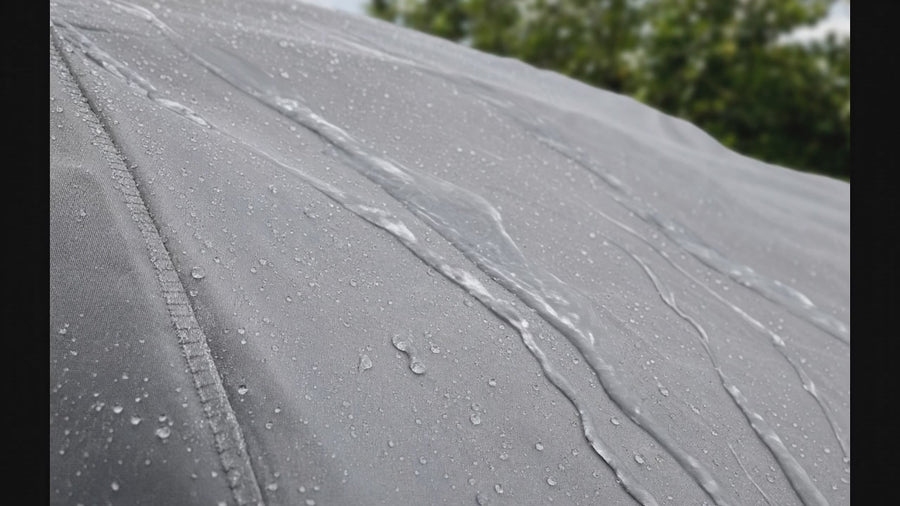 Macro of water sheeting off Coverking Autobody Armor car cover outer layer without soaking through